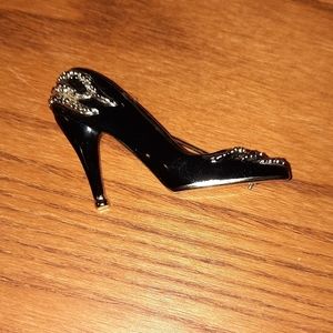 Black enamel high heel shoe brooch marked AJC